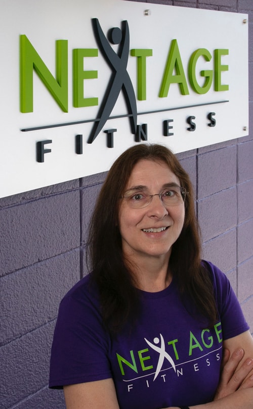 Tammy Mealy in front of NAF sign